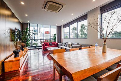 Plenty of natural light 4BR apartment with natural wood furniture and flooring on Tay Ho Road